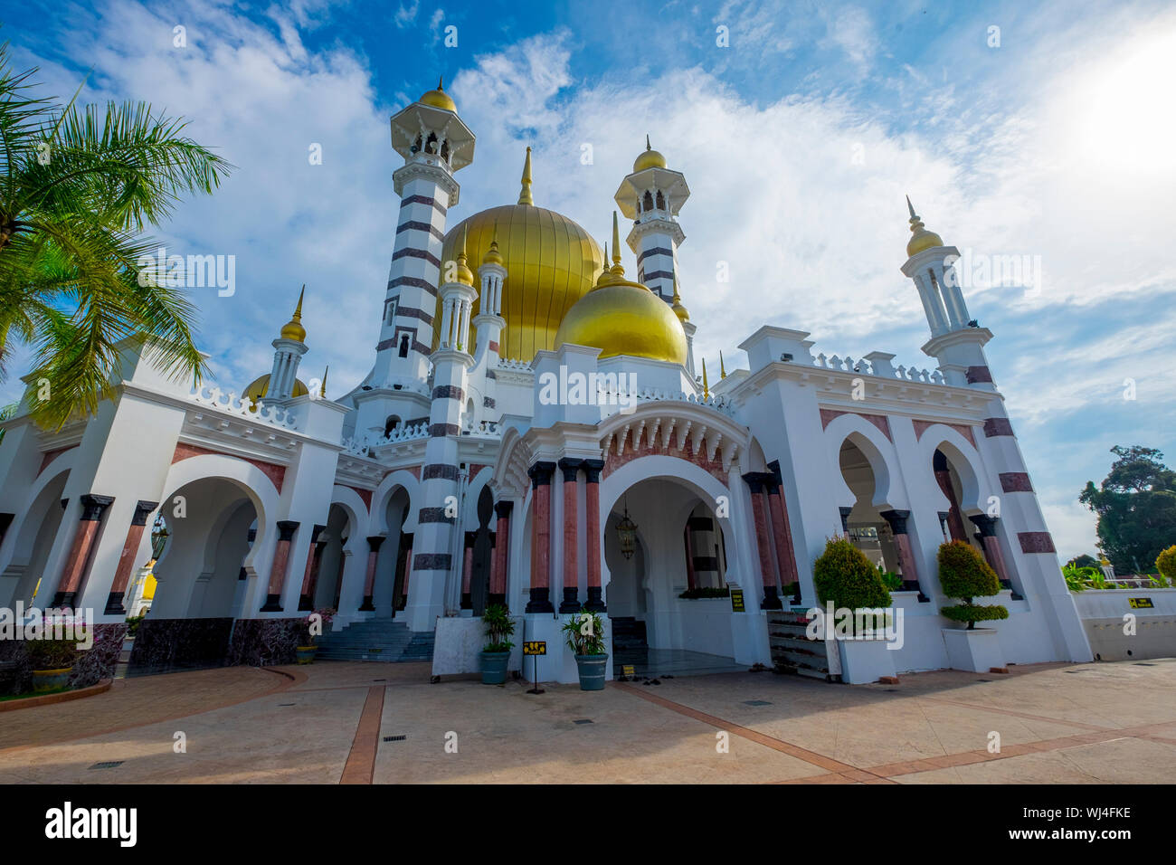 Exterior view of the striking, gold onion dome Moorish design Ubudiah Royal Mosque in Kuala