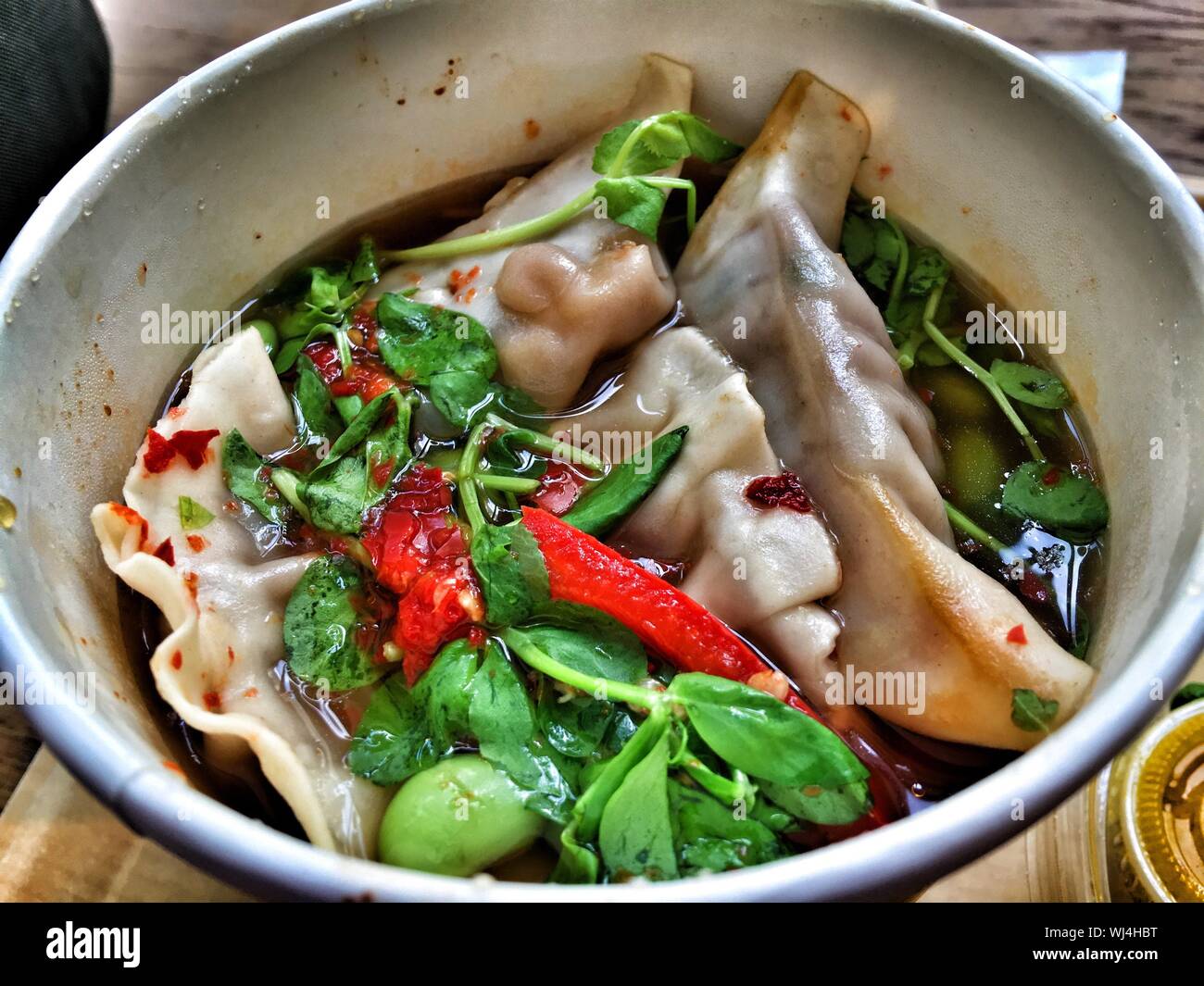 Download High Angle View Of Duck Gyoza In Bowl Stock Photo Alamy Yellowimages Mockups