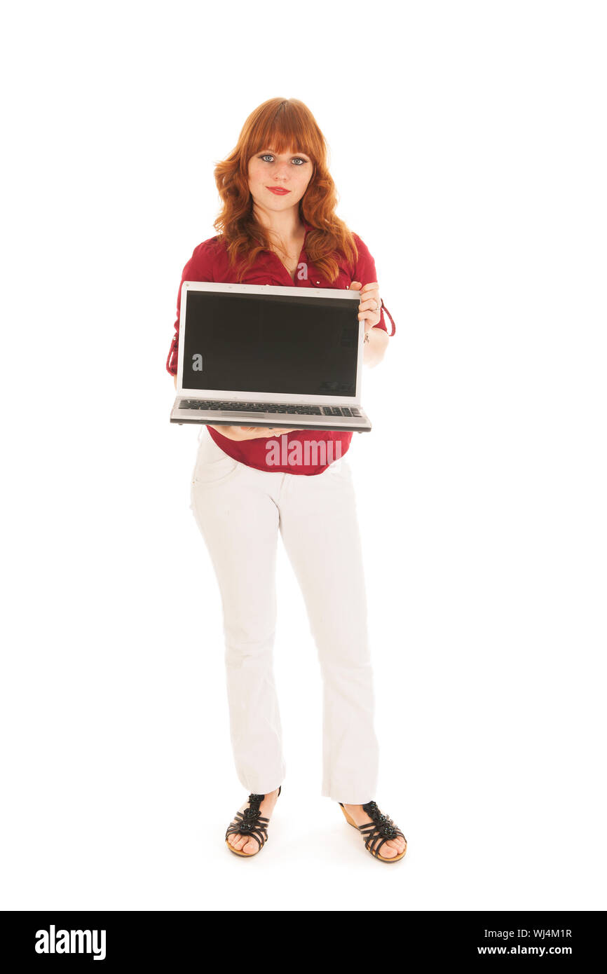 Woman standing in studio and showing screen laptop with copy space Stock Photo