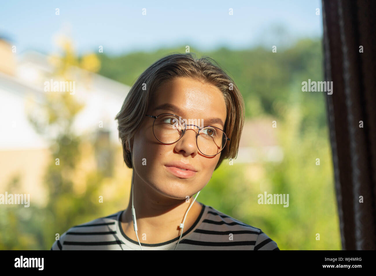 Young woman listening to music with headphones Stock Photo