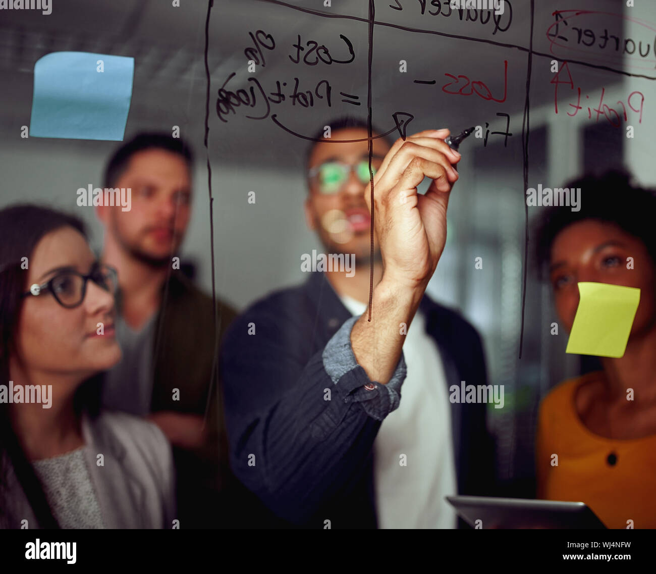 Group of multicultural creative employees collaborating on creating presentation Stock Photo