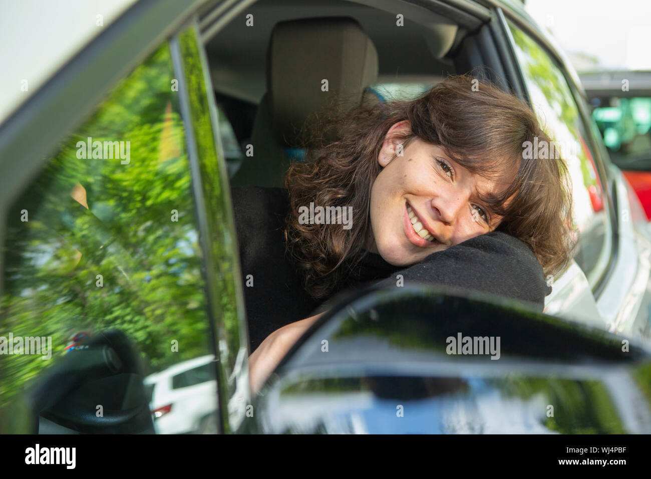 Portrait smiling woman driving car Stock Photo