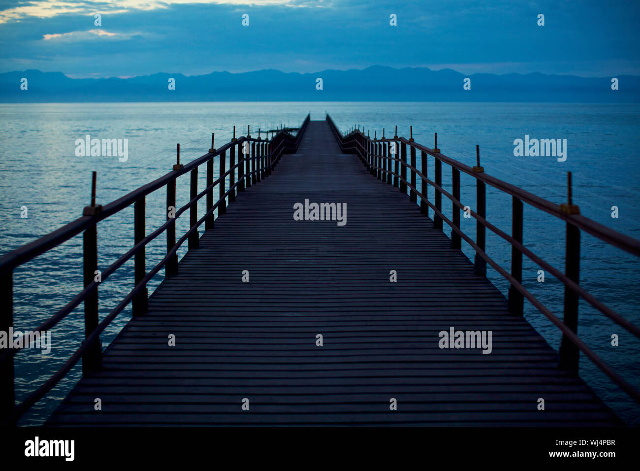 Pier extending over tranquil ocean, Punta de Mita, Nayarit, Mexico Stock Photo