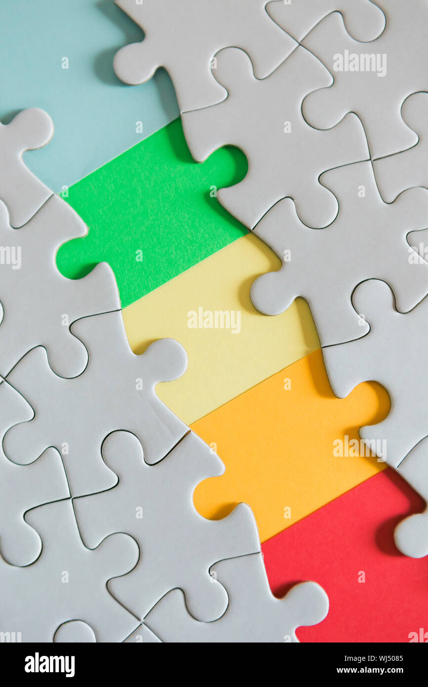 Rainbow missing jigsaw puzzle pieces Stock Photo
