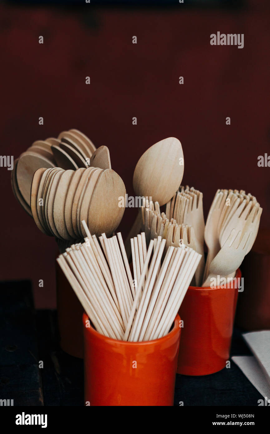 Bamboo fork, spoon and chopstick utensils in crocks Stock Photo