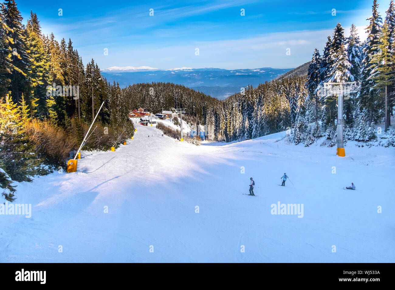Bansko, Bulgaria ski resort panoramic view with mountain peaks, pine trees,  ski slope, restaurants and ski lifts Stock Photo - Alamy