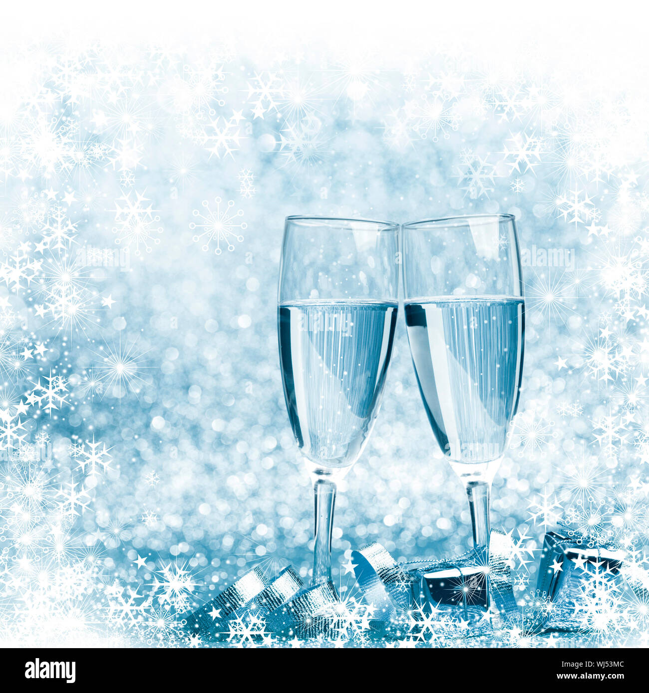 New year champagne and gifts with snowflakes and stars Stock