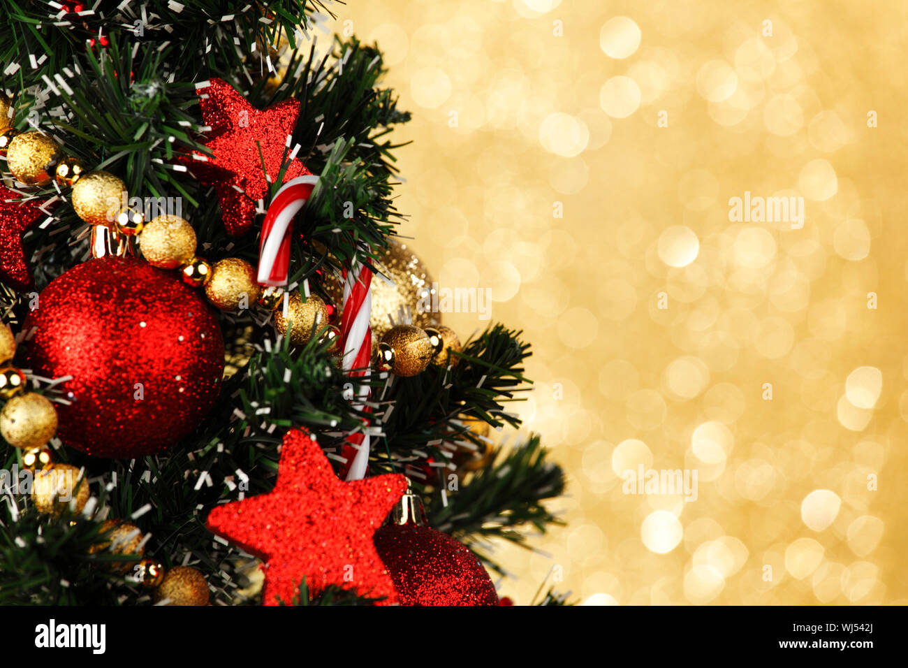 Beautiful decorated Christmas tree on glitter background Stock Photo ...