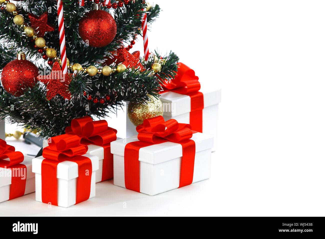 Decorated Christmas tree isolated on white background Stock Photo - Alamy