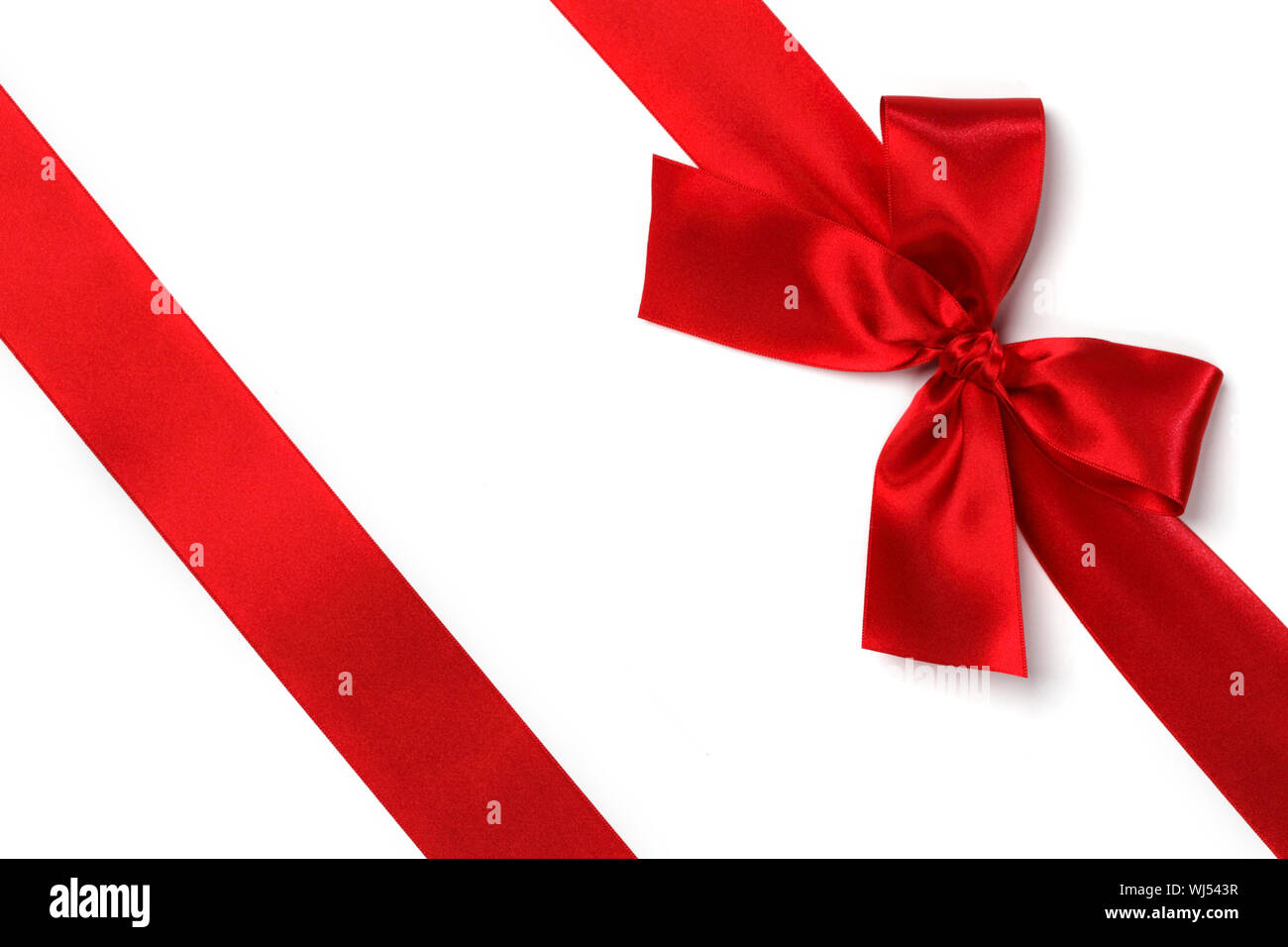 Red ribbon with bow isolated on white background Stock Photo - Alamy