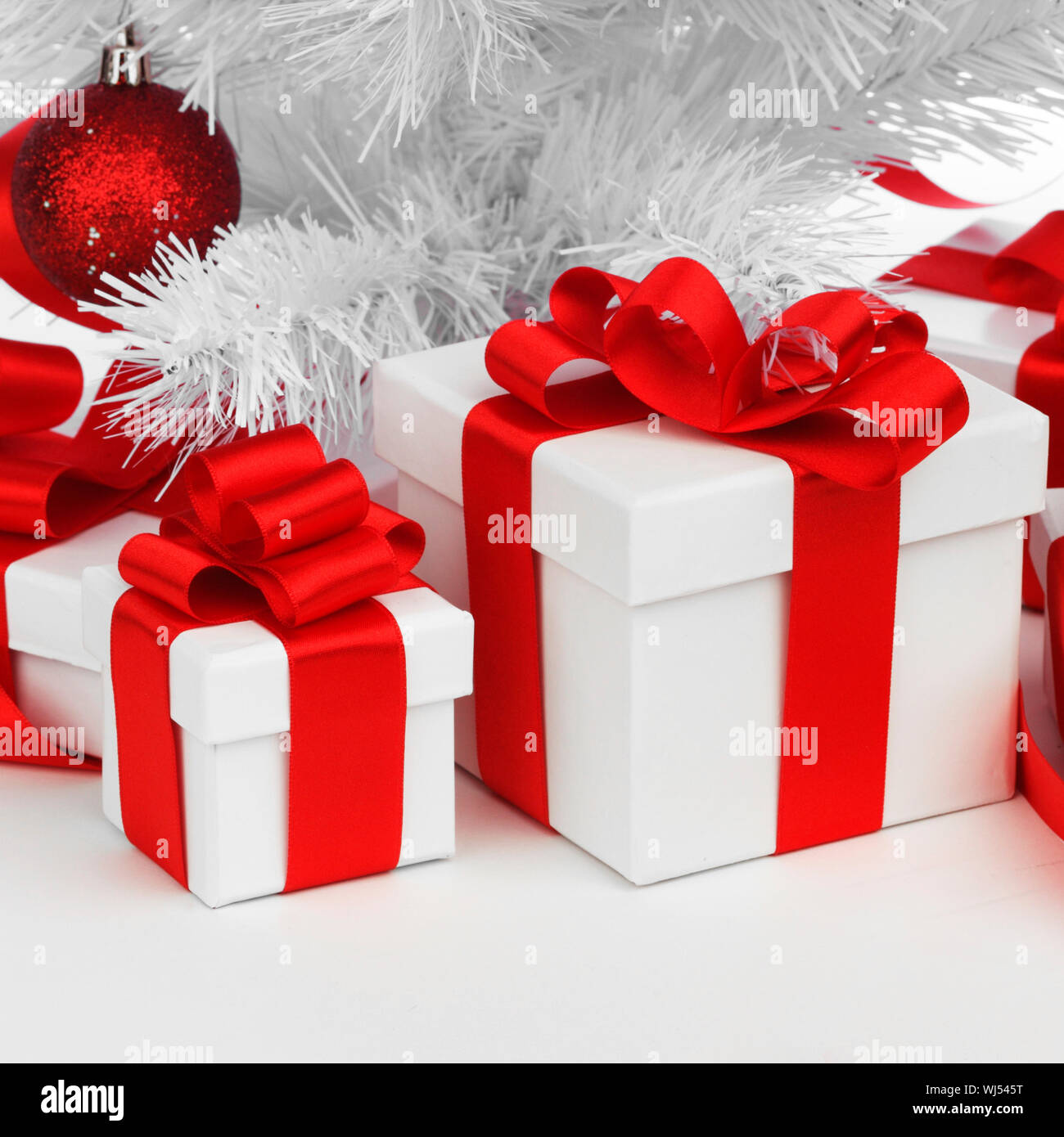 Christmas tree and gifts isolated on white background Stock Photo - Alamy