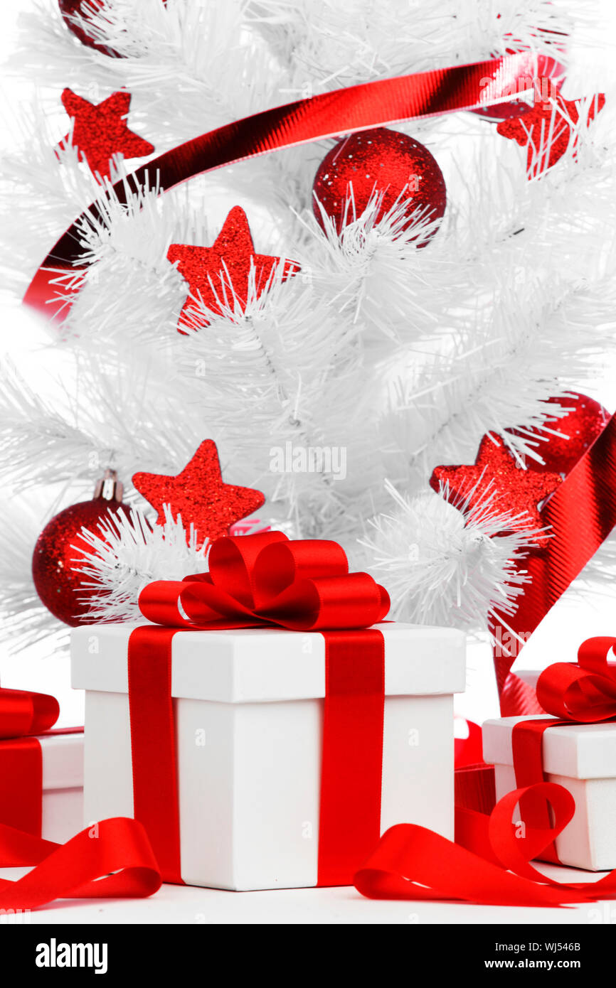 Christmas tree and gifts isolated on white background Stock Photo - Alamy