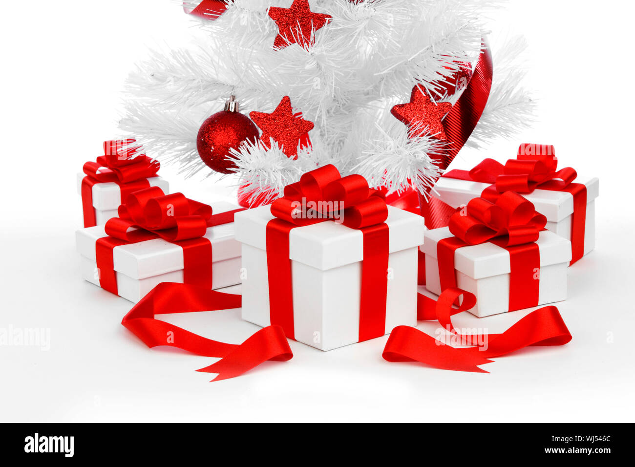 Christmas tree and gifts isolated on white background Stock Photo - Alamy