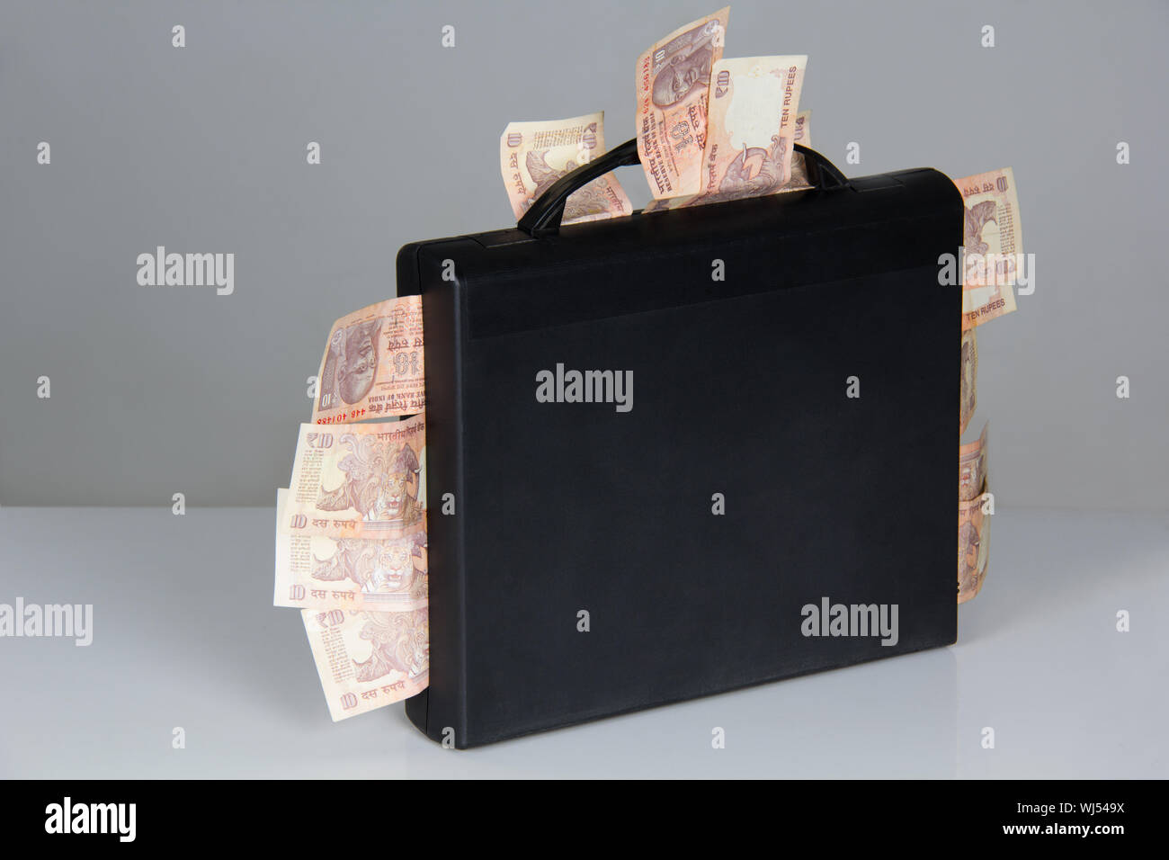 Briefcase full of money Stock Photo Alamy