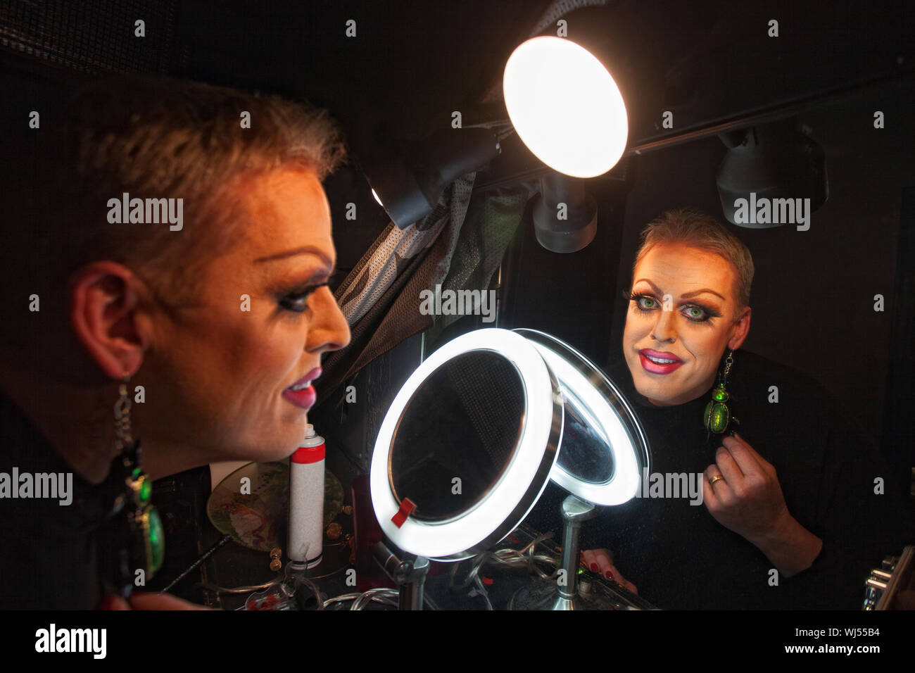Caucasian drag queen at mirror in dressing room Stock Photo Alamy