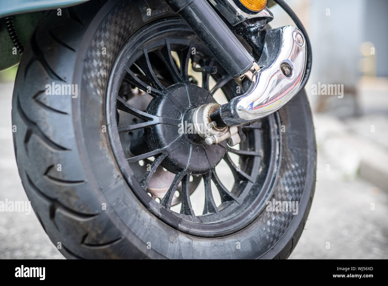 Front wheel of electric motorbike scooter Stock Photo Alamy