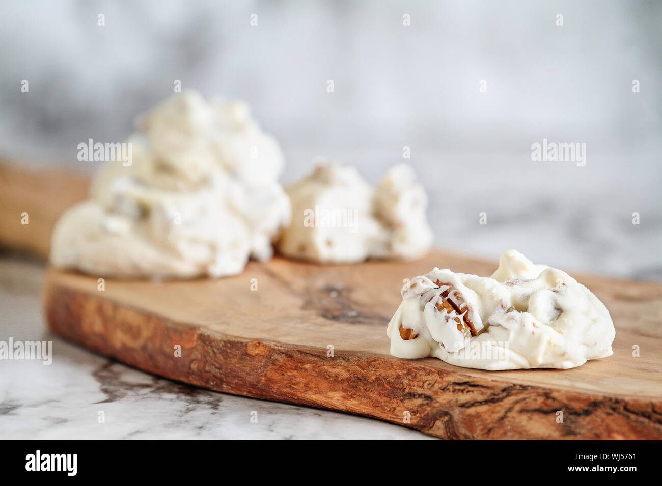 Keto butter pecan fat bombs. Made with pecan nuts, coconut oil and butter. .Selective focus with blurred background. Ketogenic diet concept Stock Photo