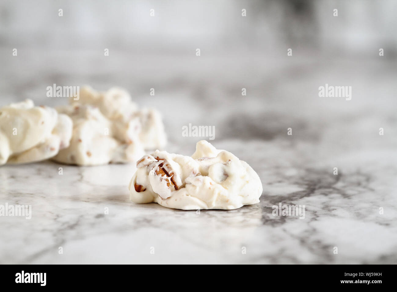 Keto butter pecan fat bombs. Made with pecan nuts, coconut oil and butter. .Selective focus with blurred background. Ketogenic diet concept Stock Photo