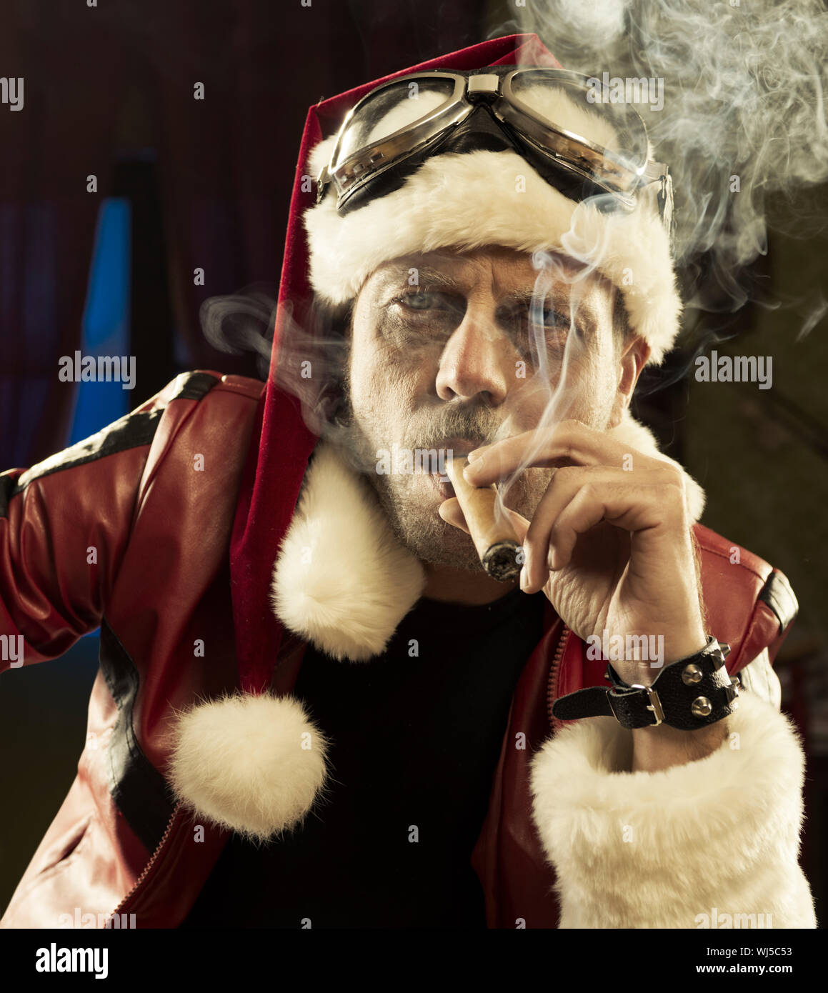 Portrait of Bad Santa smoking a cigar Stock Photo