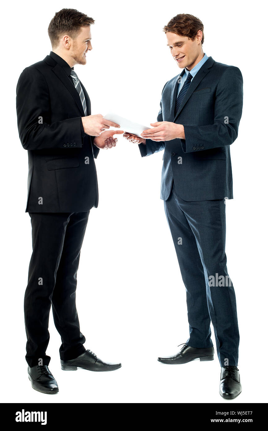 Business executives discussing the reports Stock Photo