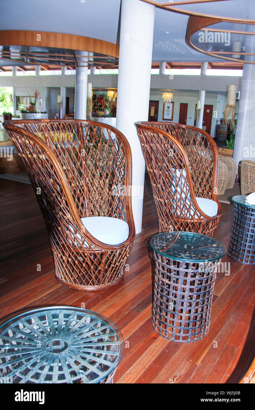 Large wicker chairs in the lobby Stock Photo - Alamy