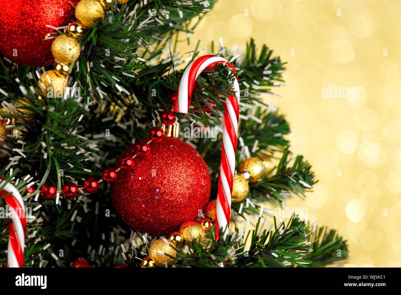 Beautiful decorated Christmas tree on glitter background Stock Photo ...