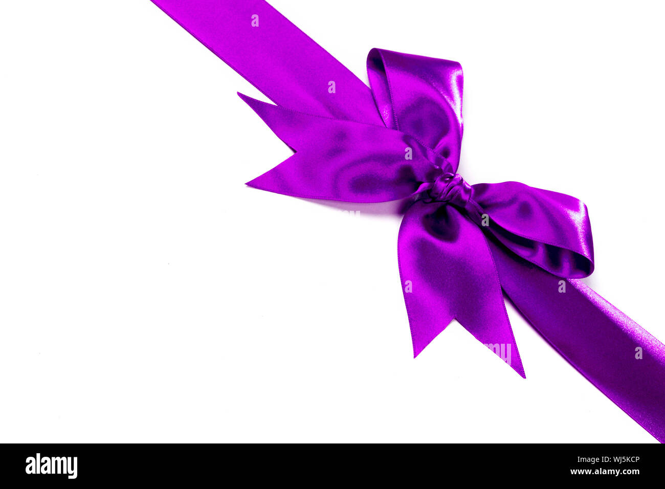Purple ribbon with bow isolated on white background Stock Photo - Alamy