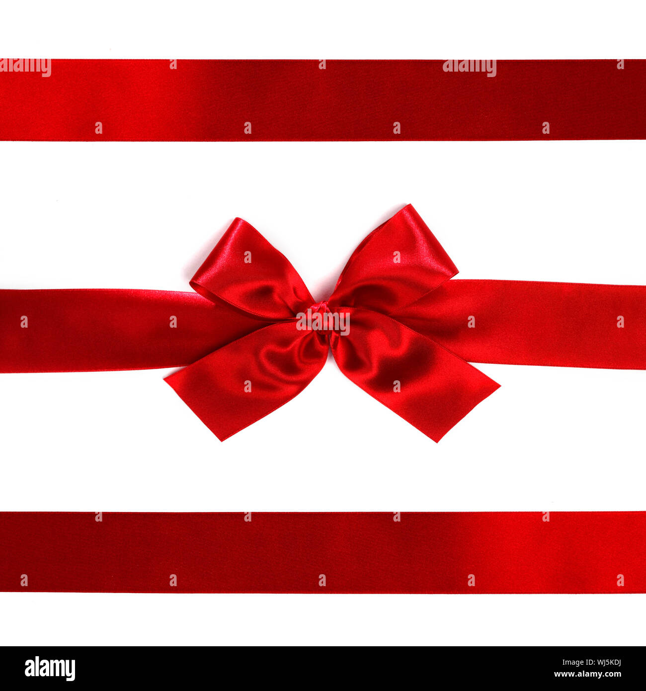 Red ribbon with bow isolated on white background Stock Photo - Alamy