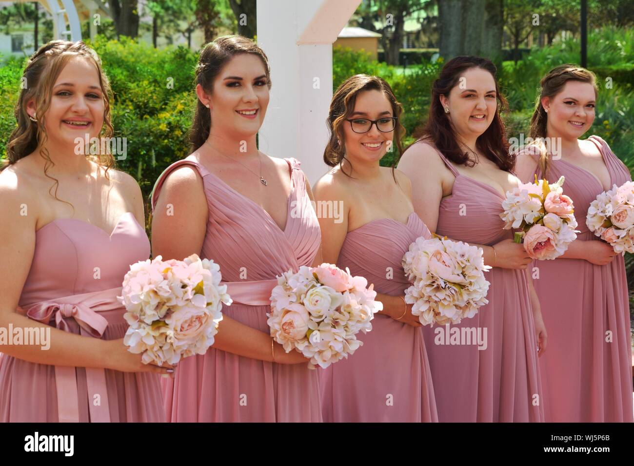 Portrait Of Bridesmaids Holding Bouquets Stock Photo