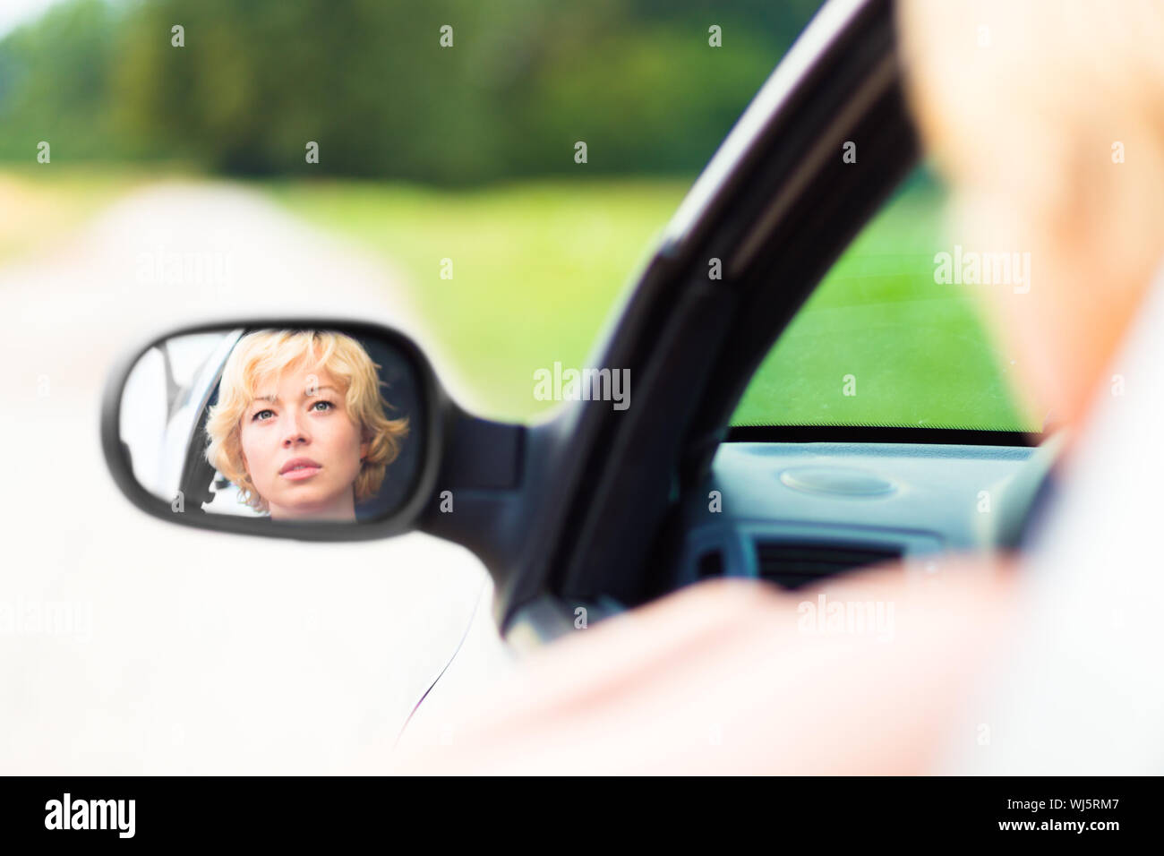 Lady driving a car Stock Photo - Alamy