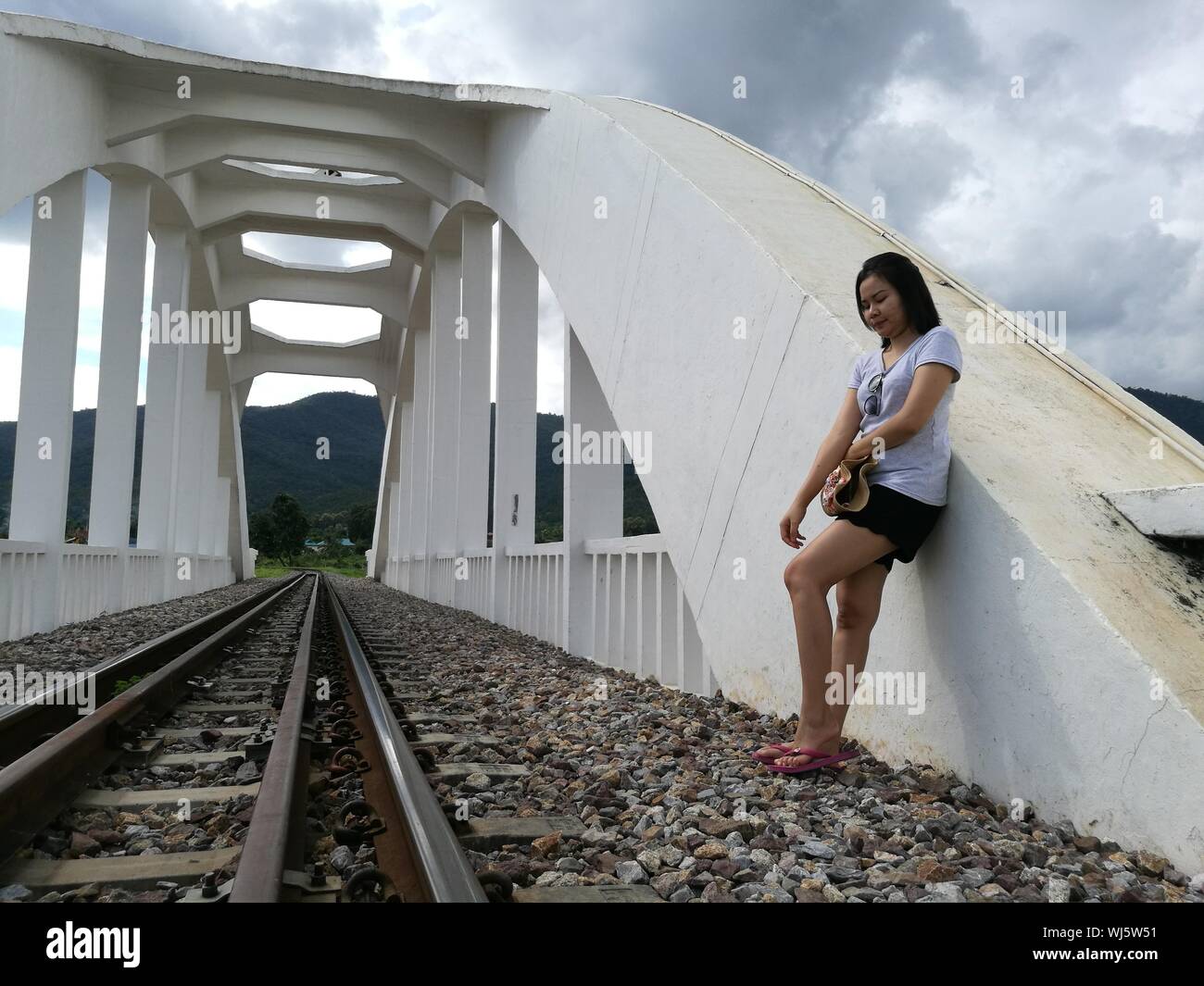 Leaning forward young woman hi-res stock photography and images - Alamy