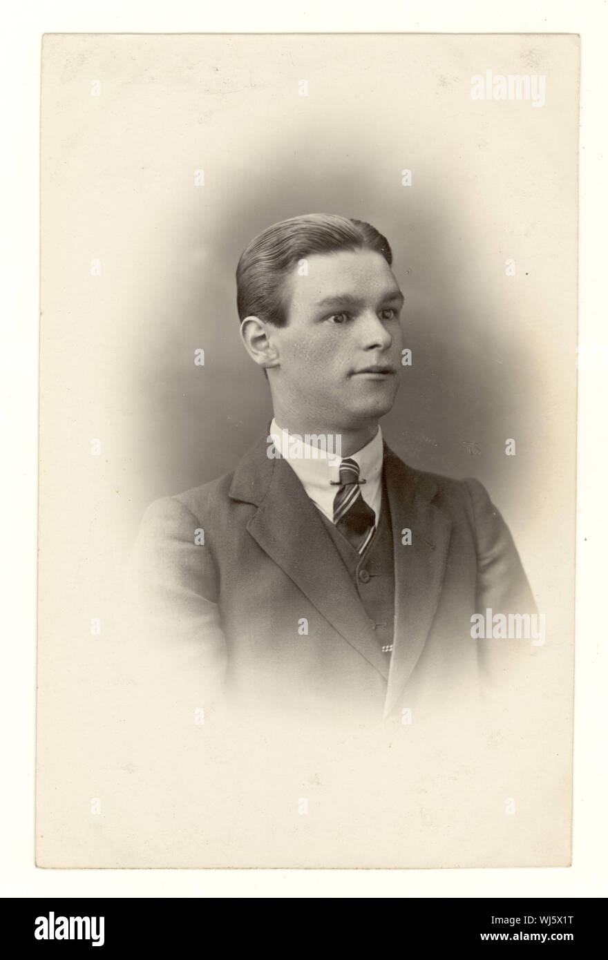 Early 1900's studio portrait postcard of young man, with a squint, from studio of Horace Dudley, circa 1916,1917, West Midlands, England, U.K. Stock Photo