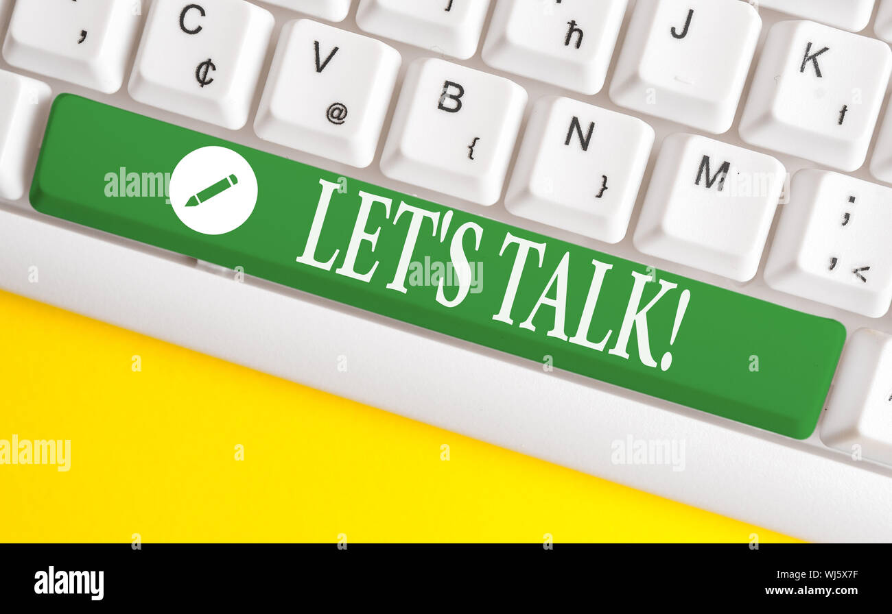 Writing note showing Let S Talk. Business concept for they are suggesting beginning conversation on specific topic White pc keyboard with note paper a Stock Photo