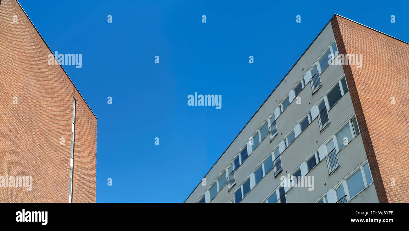 Apartment buildings with blue sky Stock Photo - Alamy