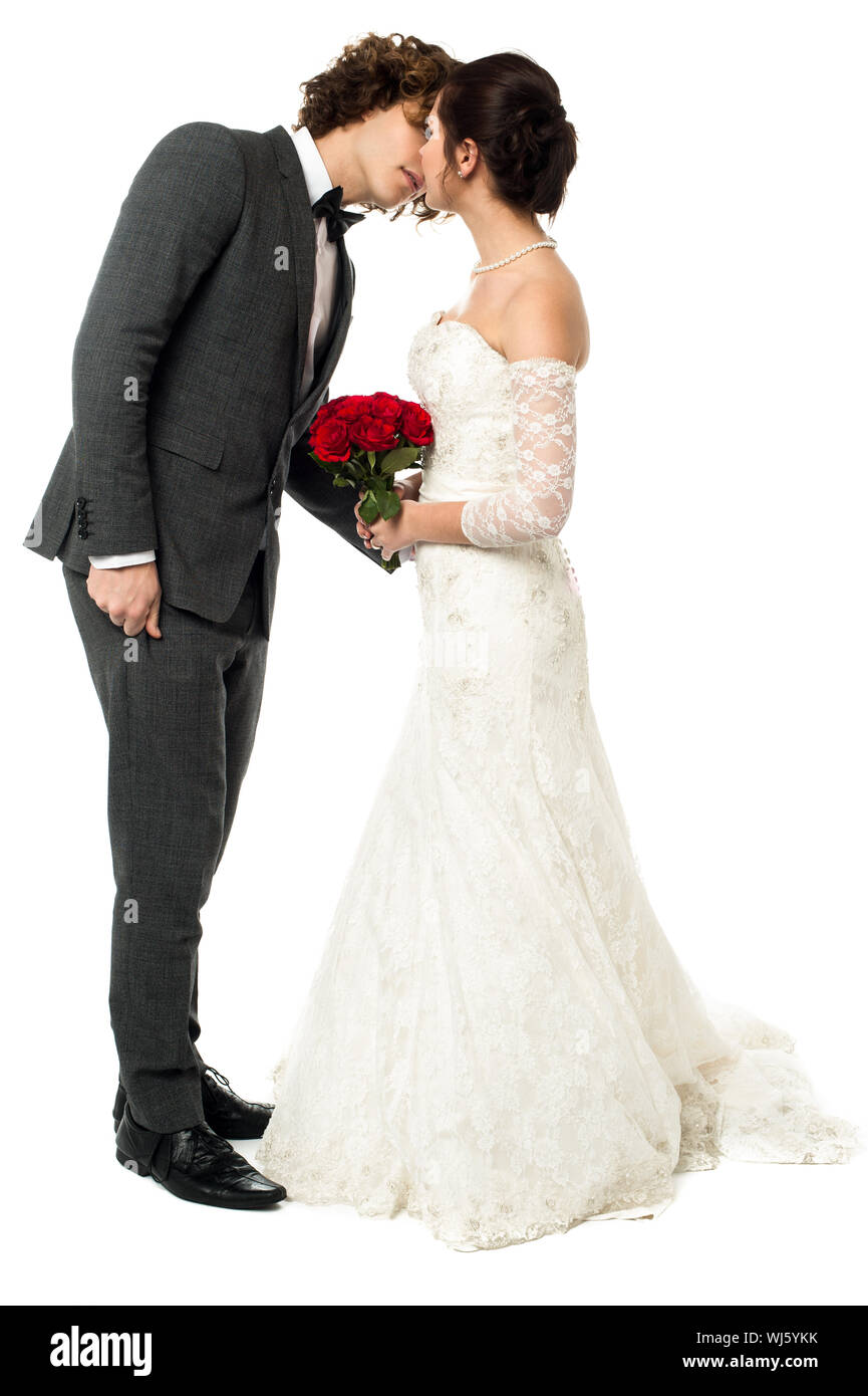 Wedding couple kissing, private moment Stock Photo Alamy