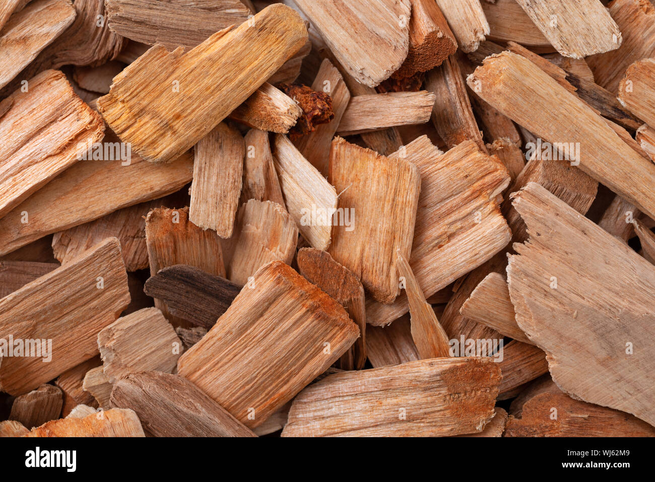 Close view of a group of alder smoking chips illuminated with natural