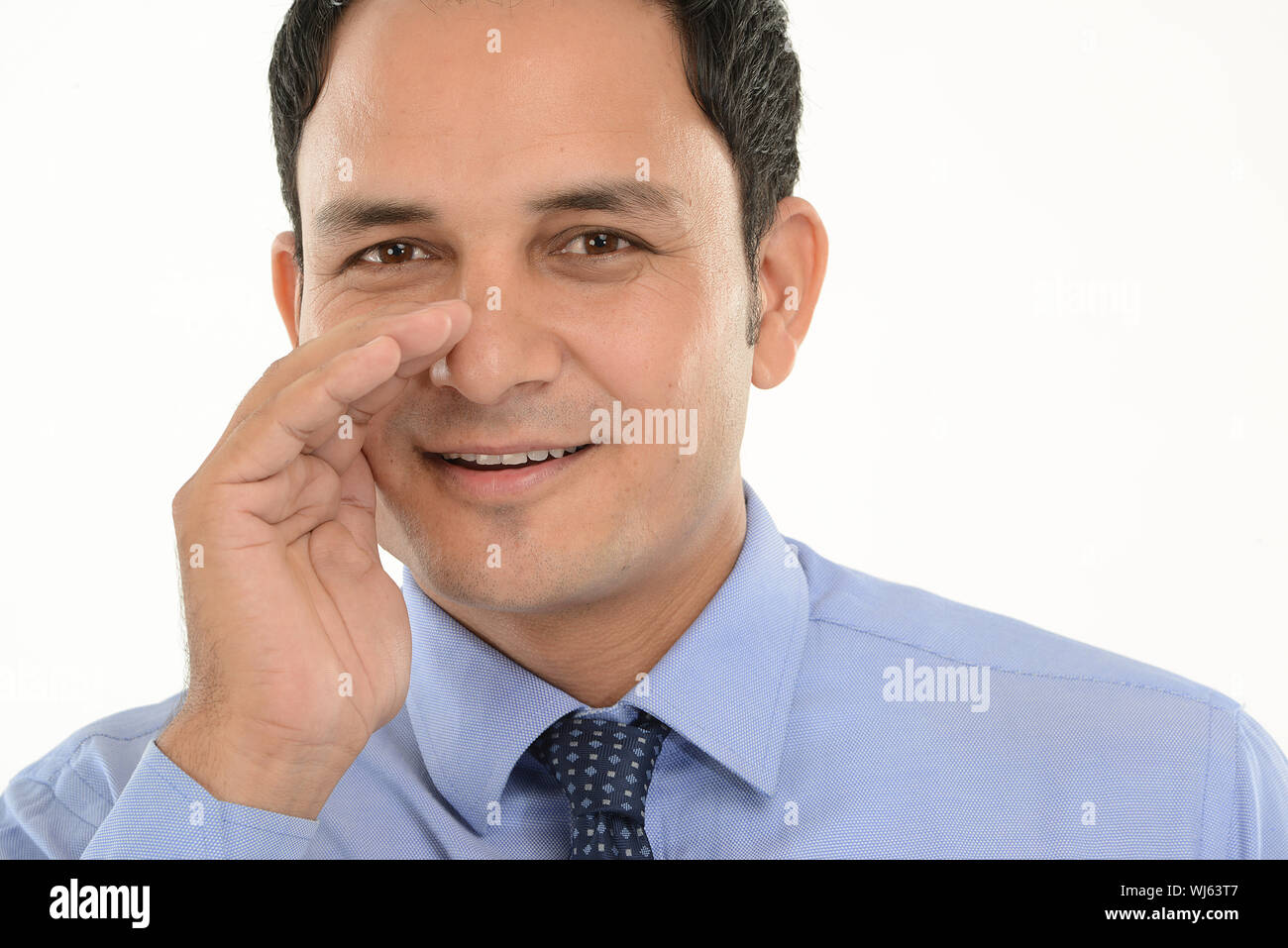 Portrait of a businessman whispering Stock Photo Alamy