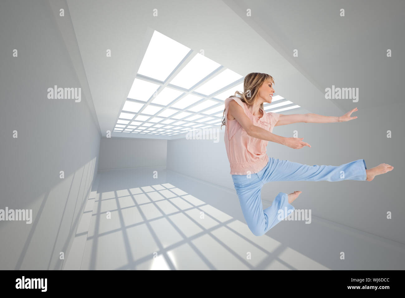 Composite image of woman doing dance pose Stock Photo