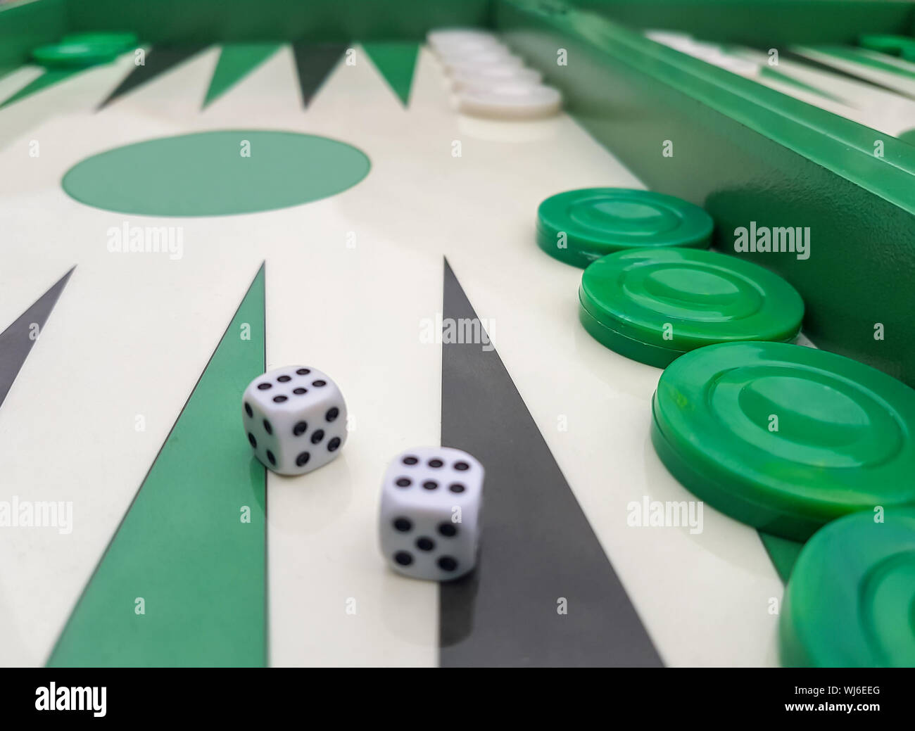 Close up of a backgammon with two dices Stock Photo - Alamy