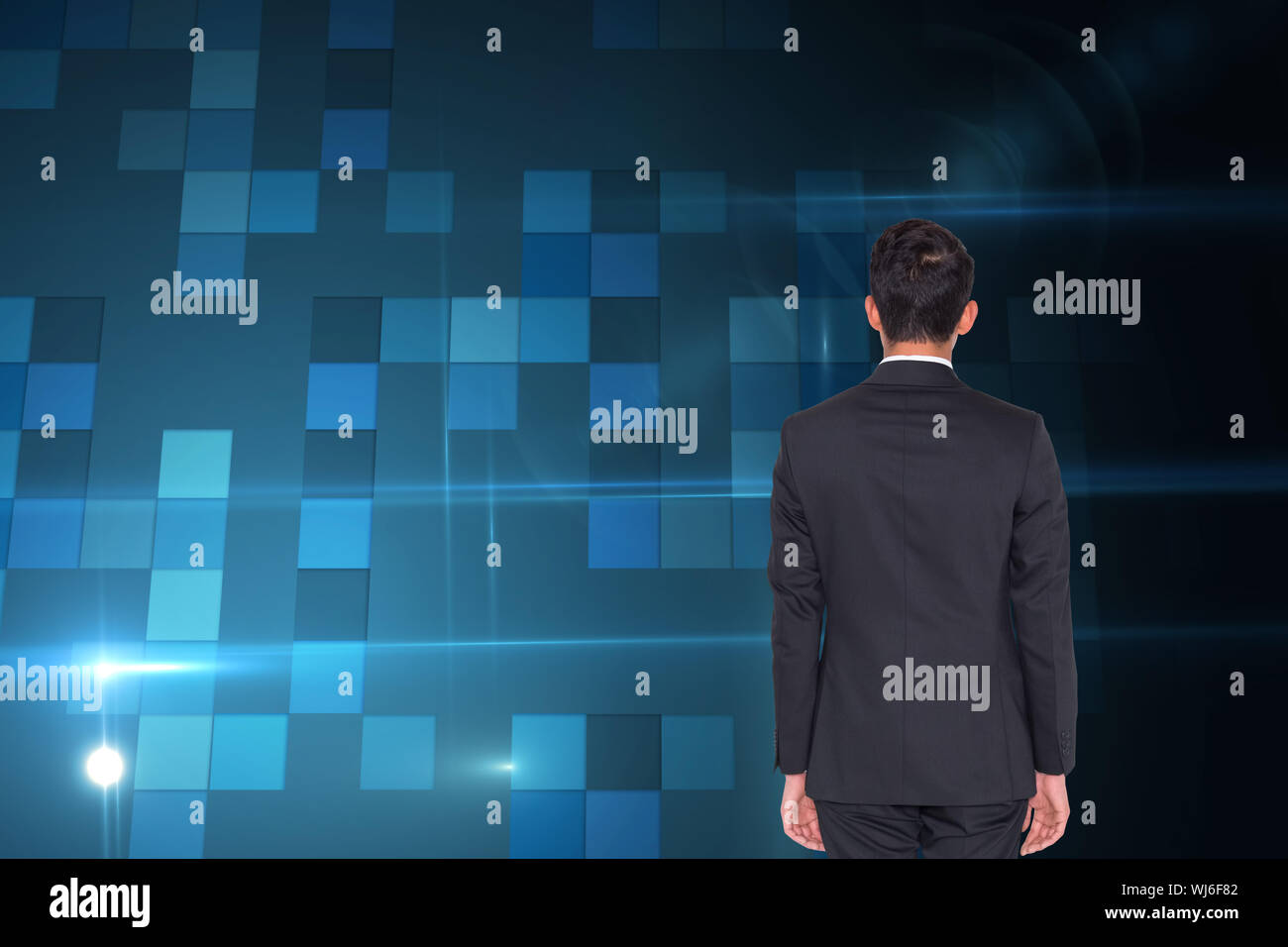 Composite image of rear view of businessman Stock Photo - Alamy