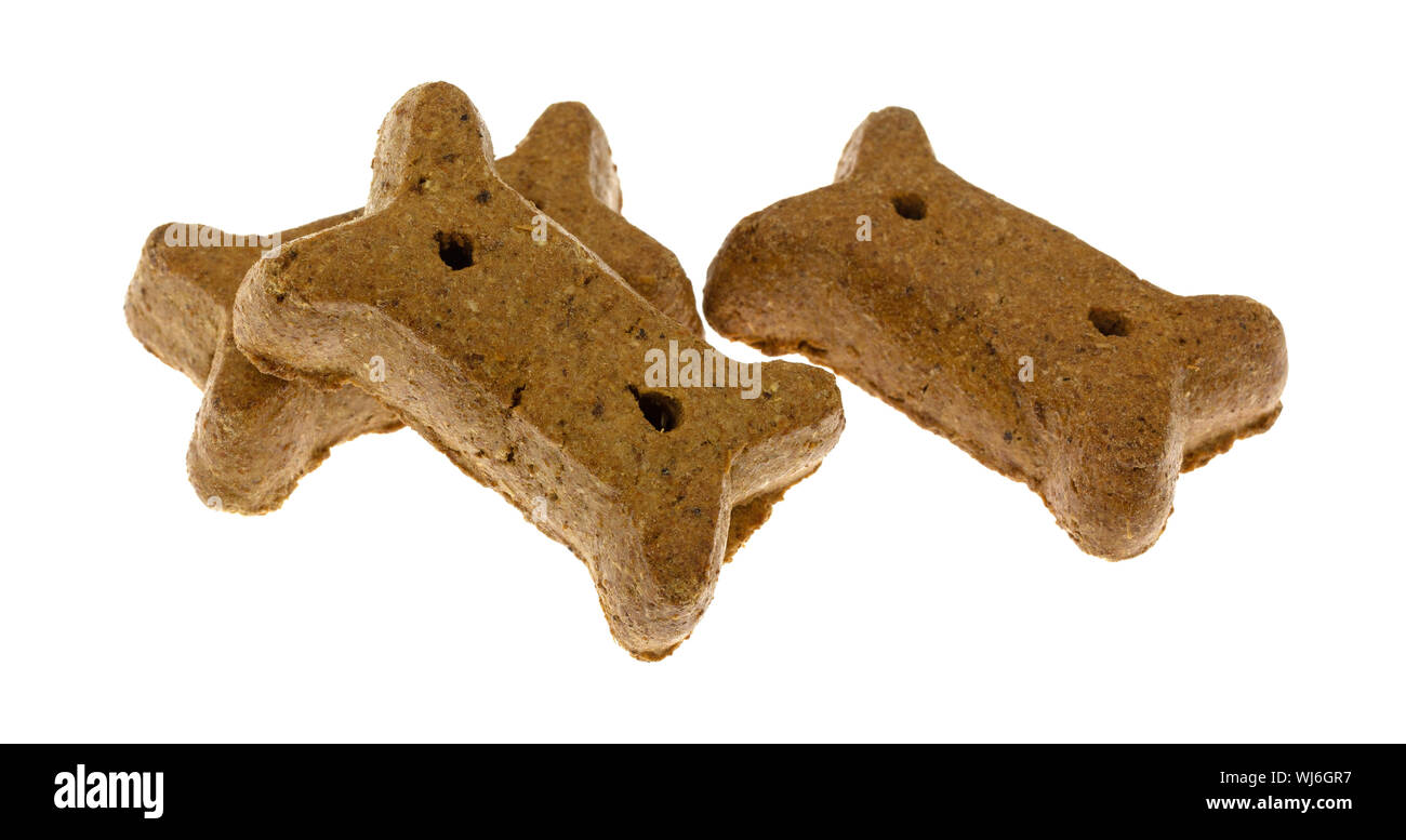 Side view of three peanut flavor dog biscuits isolated on a white