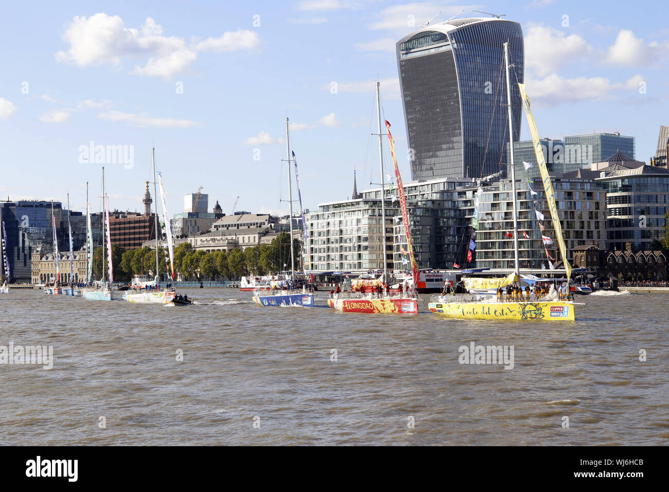 Clipper Round The World Race 2019-2020. Yachts on the River Thames heading towards Tower Bridge and the Thames Estuary for the race start off Southend Stock Photo