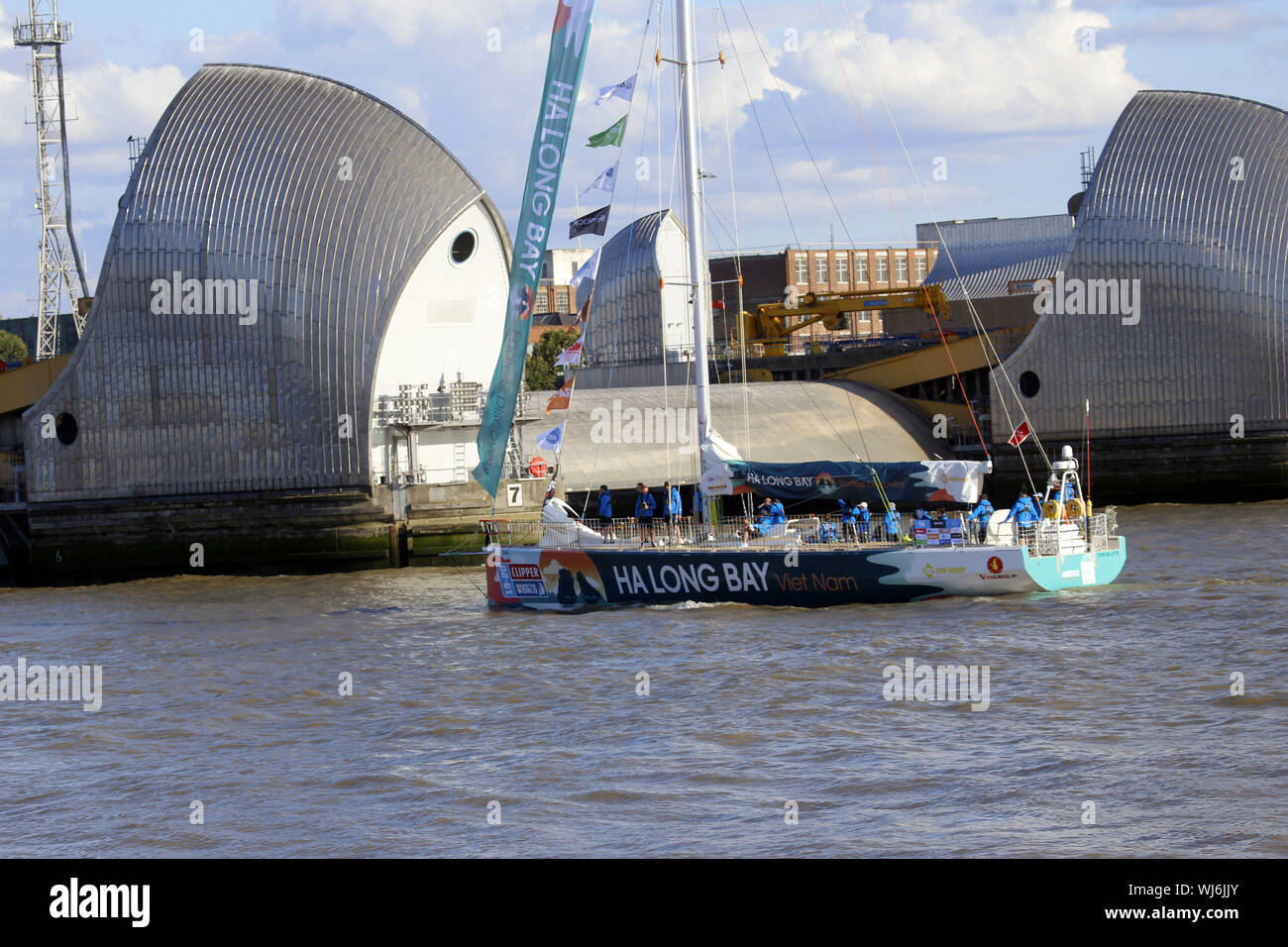 Clipper Round The World Race Yacht Bermuda heading down the River Thames through the Thames Barrier towards the start line off Southend Stock Photo