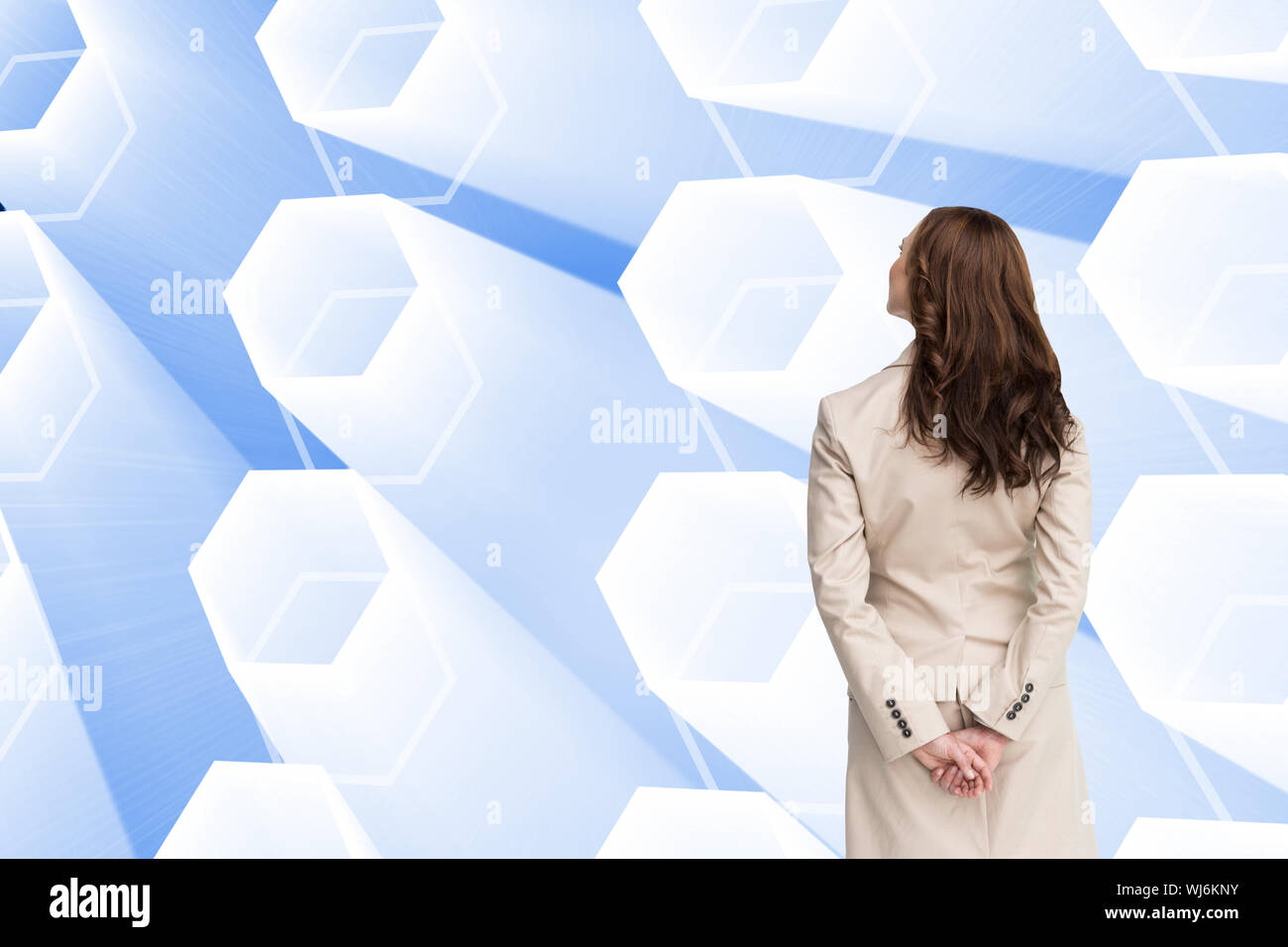 Composite image of rear view of businesswoman looking away Stock Photo ...
