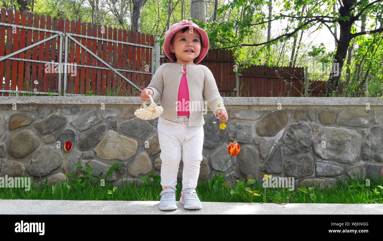 baby holding basket