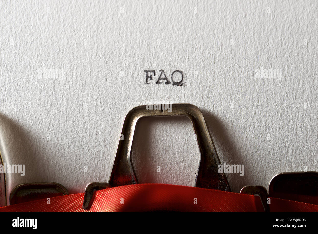 The abbreviation, FAQ, written with a typewriter Stock Photo - Alamy