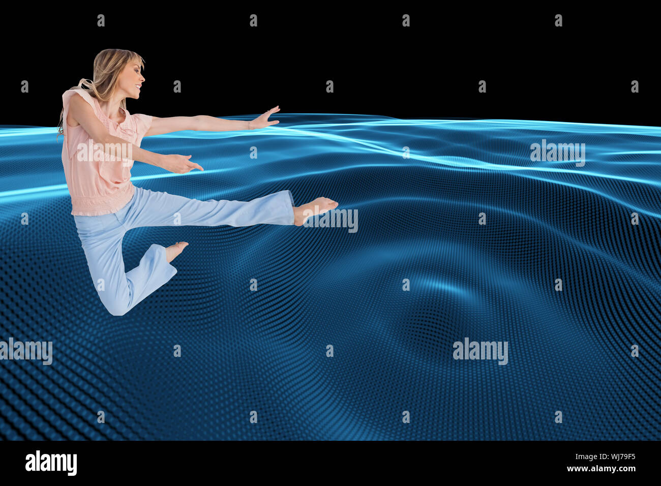 Composite image of woman doing dance pose Stock Photo