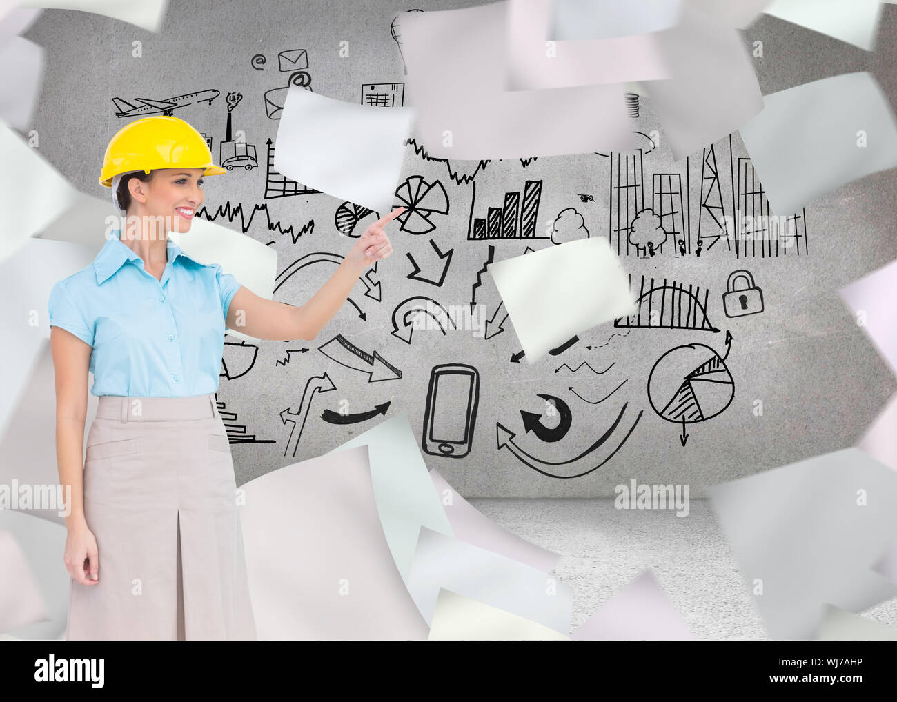 Composite image of smiling attractive architect pointing Stock Photo