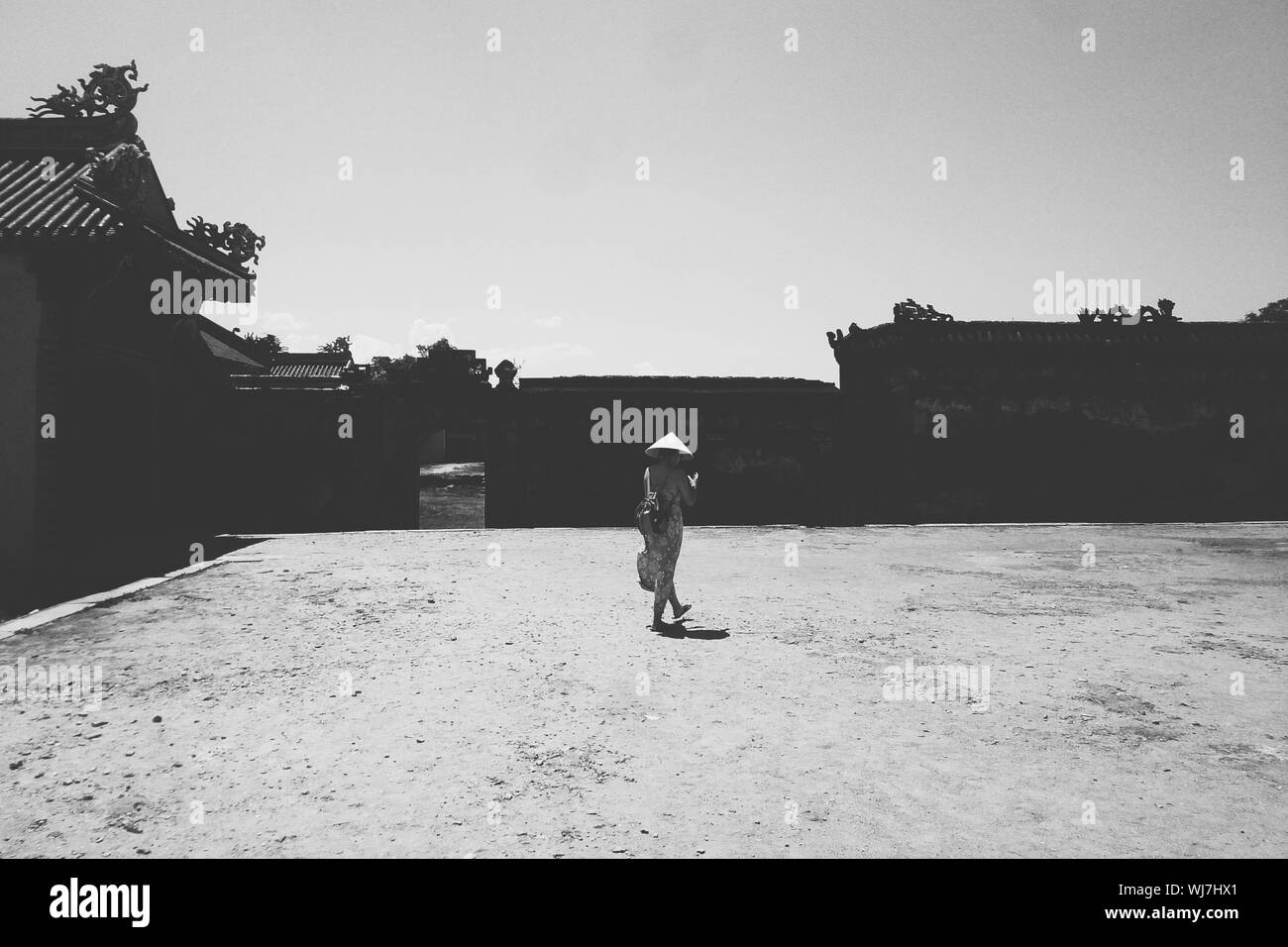 Asian woman walking rear view Black and White Stock Photos & Images - Alamy
