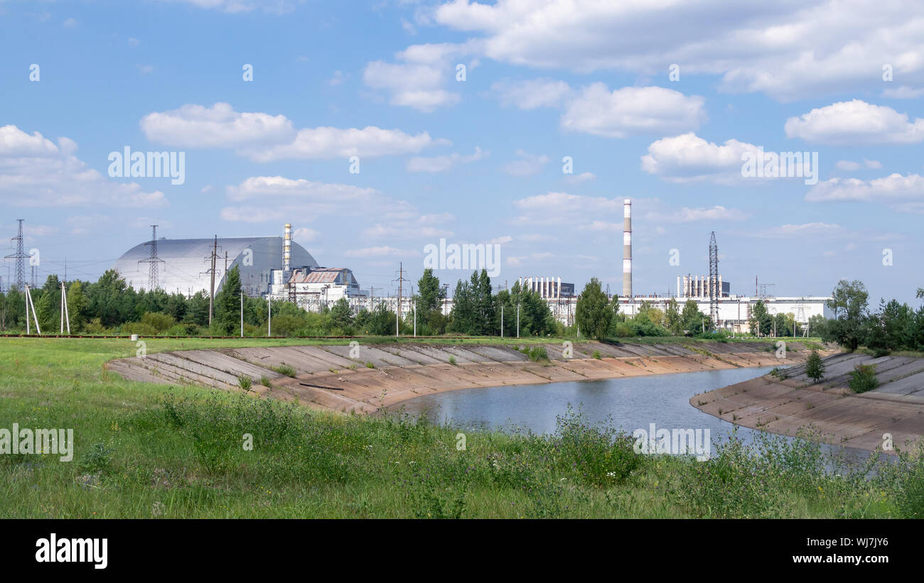 Panoramic view of Chernobyl Nuclear Power Plant with the Chernobyl New Safe Confinement of the reactor 4 on the horizon Stock Photo